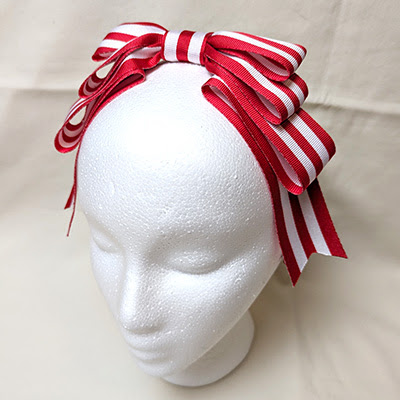 Red and white striped head bow