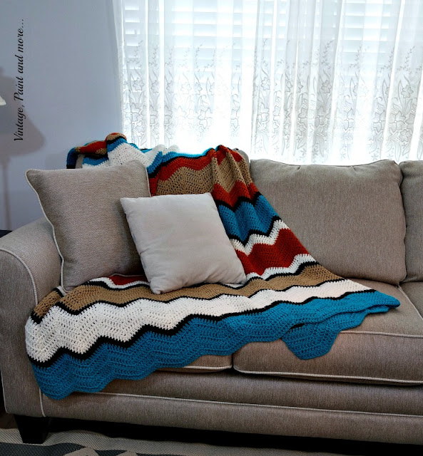 A crochet afghan done in a ripple pattern