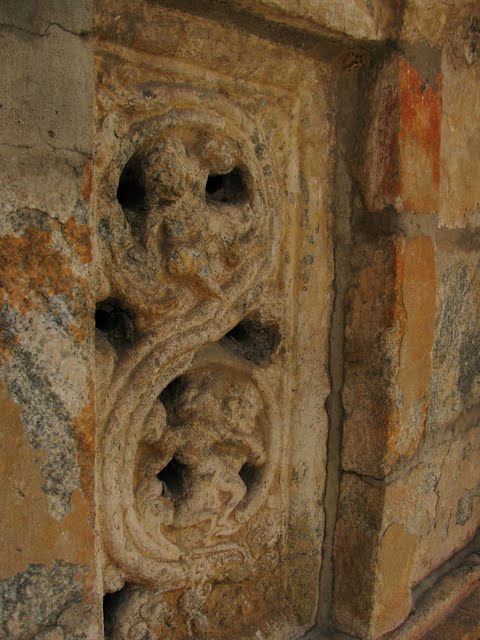 A closeup of one of the windows on the side of the temple