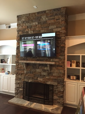 Flat screen tv mounting in Charlotte NC, Fort Mill SC, Huntersville NC, Flat screen tv mounted on stone fireplace 