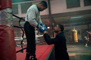 Jonathan Majors stars as Damian Anderson and Michael B. Jordan as Adonis Creed in CREED III A Metro Goldwyn Mayer Pictures film