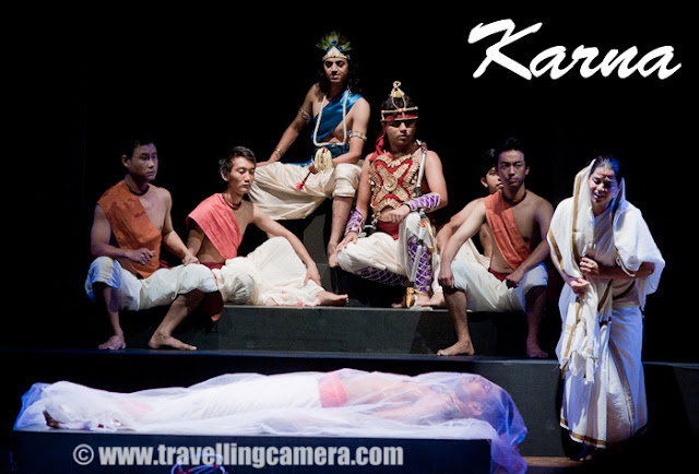 KARNA - A Theater play by second year students of National School of Drama !!! (24th to 29th May 2011) : Posted by VJ SHARMA on www.travellingcamera.com : Last month (May 2011), Second year students of National School of Drama performed a play called Karna in Abhimanch Auditorium. Here are some photographs form this play with some description about the play !!! This is a play about the life of Karna who is an important character in Mahabharata !!! Play starts with the childhood of Karana and then becoming a Yudha with all appropriate things !!!This play had wonderful lighting and Music !!!Some of the characters of Karna Play singing a beautiful song during the beginning of this play !!! Some of them plays the role of Pandvas, their mother and other shoodr girls from the village...Karna, getting ready for Yudh with Arjun !!!This play held at Abhimanch Auditorium, National School of Drama ( NSD ), Bahawalpur House , 1 Bhagwandas Road, New Delhi-110001Girl carrying a metallic pot to bring water for Karna afterhe gets ready for 'yudh-bhoomi'Karna taking all the good wishes from him mother, before going for 'yudh' with Aruna...Karna in surprized to see Arjuna attacking him while we requested to pause for some time, so that he could pull out the wheel of his 'Rath'  and place it in appropriate position...Krishna was continuously talking to Arjuna and motivating him to not stop and continue towards the win !When Karna dies in the war, play starts talking about various 'Shraps' he had got during his life...Here is Kunti explaining about the incident which caused the birth of Karna and explaning to her sons that he was their elder brother.After death, there was a confusion about the final ceremonies - who will do it ? Shoodr family, who took care of Karna all through his life from childhood or the original mother? Kunti took his dead body and the shoodr village continued with their local ceremonies...A wonderful play with amazing lighting and sound !!! The music used between various scenes was wonderful !!!