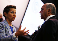 The French Foreign Minister, Laurent Fabius, talks to Christiana Figueres, the executive secretary of the U.N. Framework Convention on Climate Change, in Bonn on Tuesday. (Photograph Credit: Oliver Berg/EPA/Landov) Click to Enlarge.