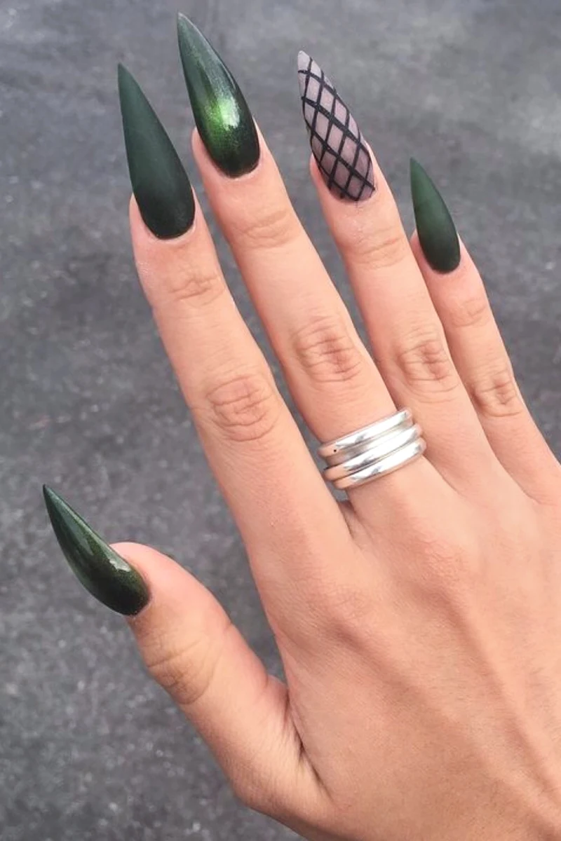 close-up of a female hand with Dragon Scales Halloween nail look