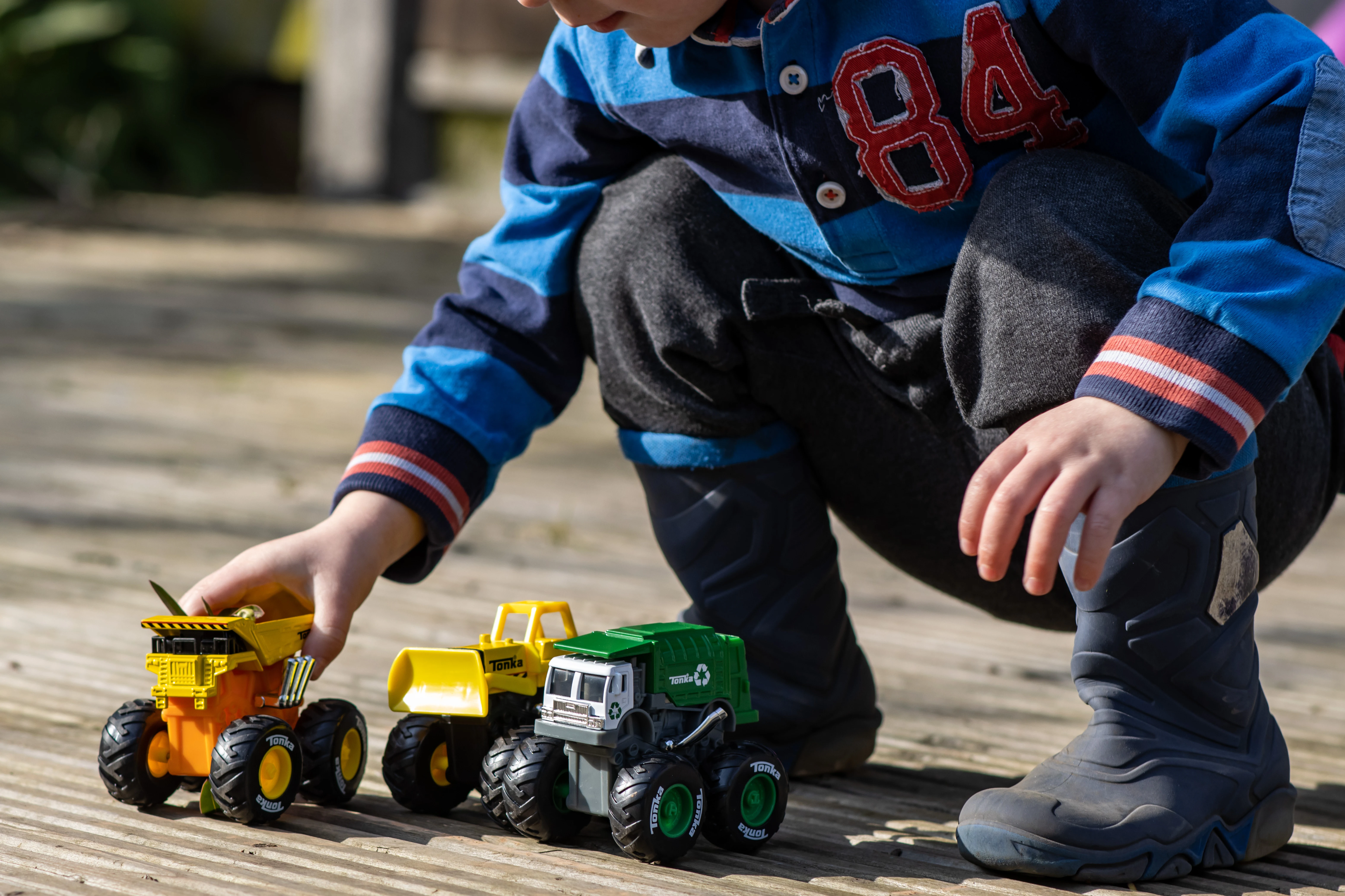 A preschooler playing with Tonka Monster Metal Mover Trucks received for review