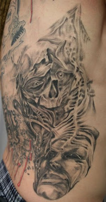 Face Skull Rib Tattoo Designs