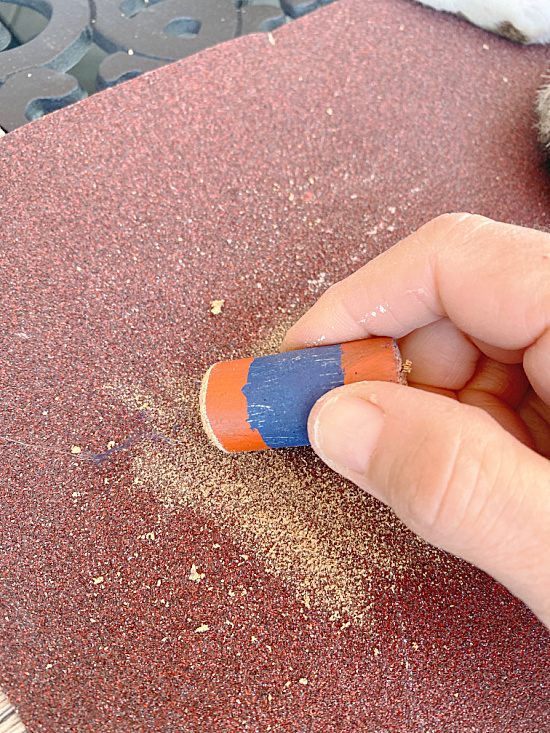 rubbing corks on sandpaper