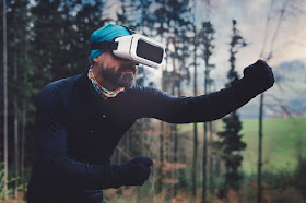 Goofy funny man playing a VR video game nerd geek