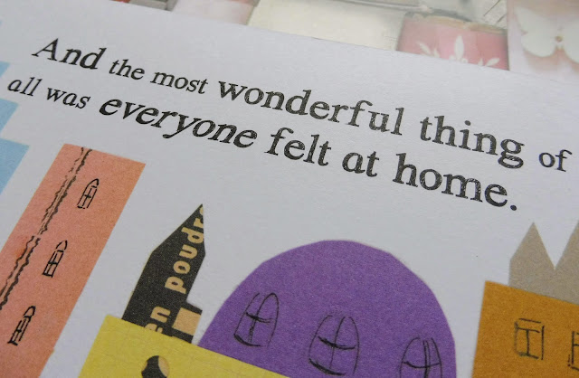 Another close up of the book Lily and The Polar Bears by Jion Sheibani. The image shows the words 'and the most wonderful things of all was everyone felt at home' alongside images of a town made from scraps of paper.