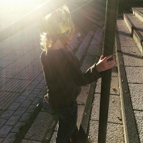 Girl wearing a golden crown in the sunshine