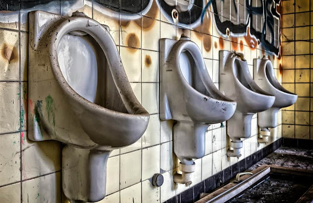 White urinals with stains