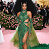 Ciara steps out at the Met Gala in emerald green cut-out gown complete with a large Afro wig