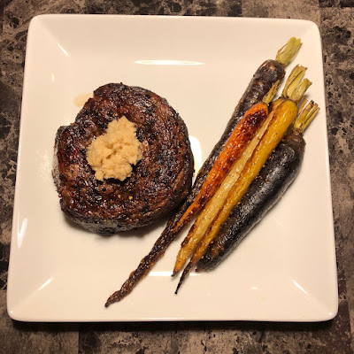 Prime ribcap grilled rare with roasted rainbow carrots