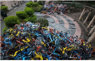 http://www.scmp.com/news/china/society/article/2062595/more-500-rented-bikes-many-vandalised-left-dumped-piles-near