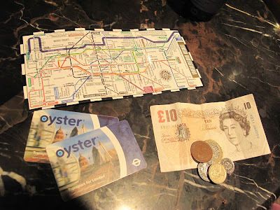 One of our Tube maps, our Oyster cards and some spare cash.