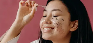 Skin peeling Peeling a glitter mask from a woman's face