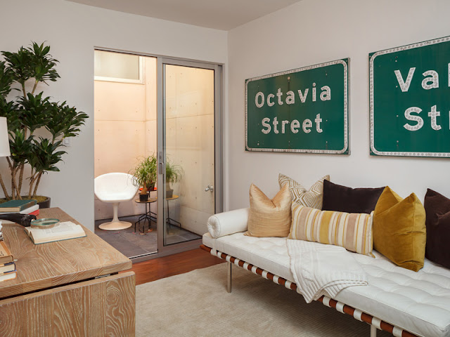 Picture of small contemporary room with road signs on the wall