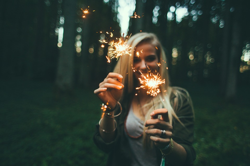 Girl play with fireworks in nature