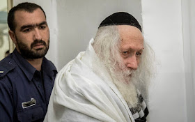 Rabbi Eliezer Berland arrives for a hearing at the Jerusalem Magistrate's Court, on February 13, 2020. (Yonatan Sindel/Flash90)