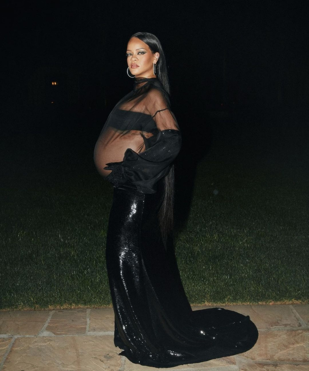 Rihanna displays her bump in sheer dress (photos)