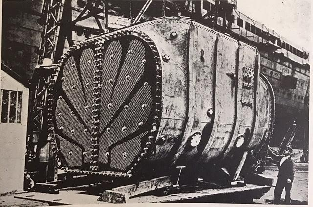 te / ss NORMANDIE, Figure 38a Main condenser prior to lifting on board  - editpors collection