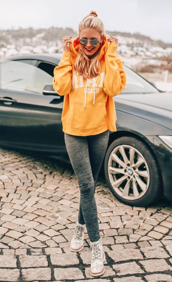 cozy fall outfit / boots + yellow hoodie + leggings