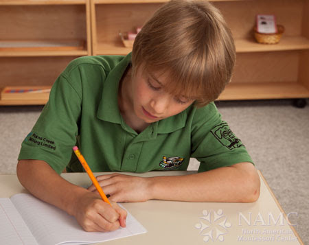 NAMC simplicity in montessori environment boy writing 