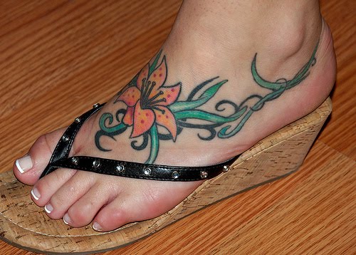 cross tattoos for women on foot. foot tattoos for women.