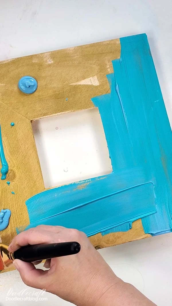 Again, paint the blank.   I used a mix of Aqua and Blue Ocean on this wood frame because I wanted it to have a rustic toned look.   By giving it both colors it makes it appear even more aged from the start.