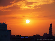 An orange sunset shot taken from my rooftop which also shows the blue neon . (dscf jeddah sunset)