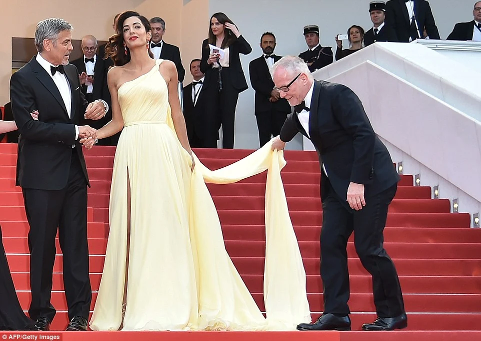 Amal Clooney struggles with thigh split gown at the Cannes Film Festival 2016