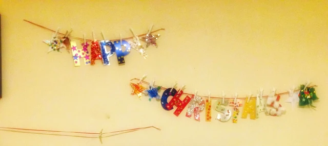 "Happy Christmas" garland decorated 