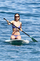Olivia Wilde paddle boaring in a bikini  while on vacation in Hawaii