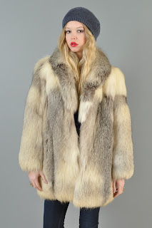 Vintage 1970's dimensional cream colored fluffy fur coat.