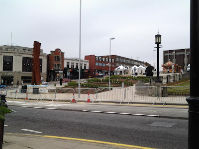 The completed Gardens, sculpture to the left, Barnsley Live gazebos being set up to the right and an old time carousel at the top.