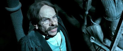 Warwick como Profesor Flitwick