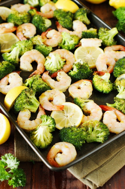 Roasted Shrimp & Broccoli Sheet Pan Supper ~ With just a little tossing of ingredients together, this one-pan dish with tasty lemony shrimp and cumin-spiced roasted broccoli is ready in under 30 minutes.   www.thekitchenismyplayground.com