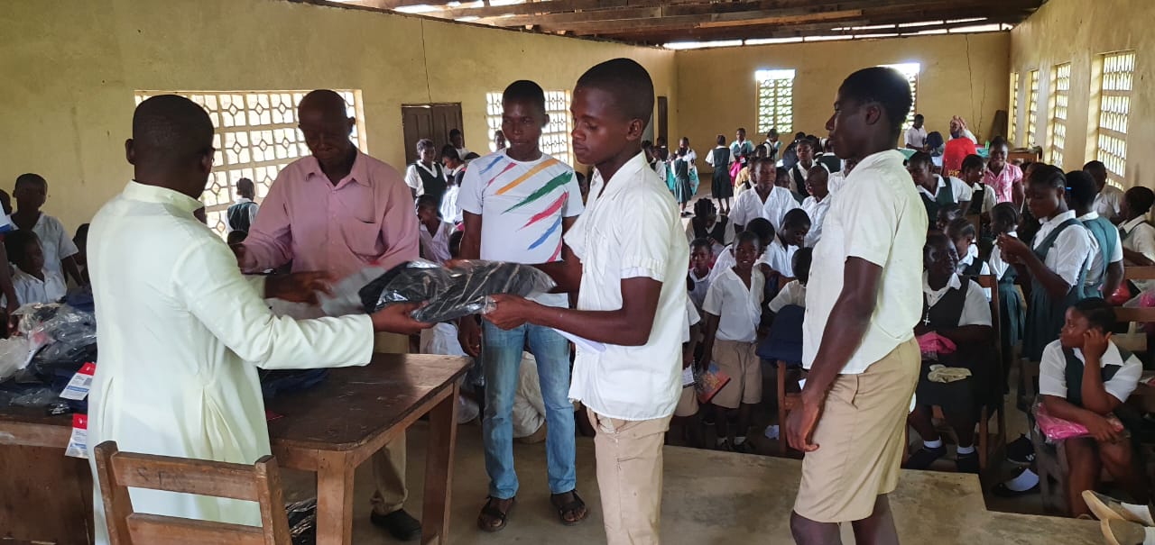 Children Receiving Supplies in school