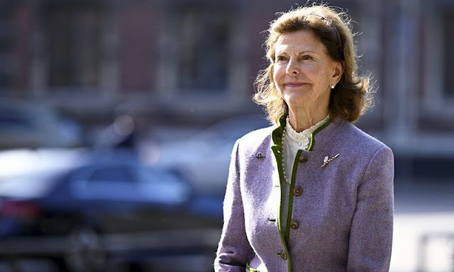 Queen Silvia wore a lilac wool tweed jacket with green trim border by Zara, Chanel. The Queen wore her wool purple trousers