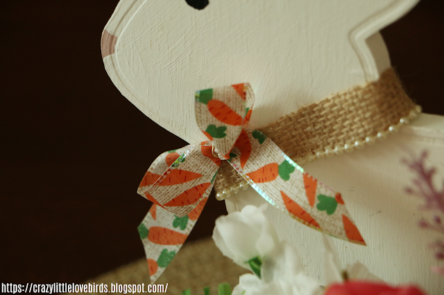 Wooden bunny with burlap ribbon and decorative bow