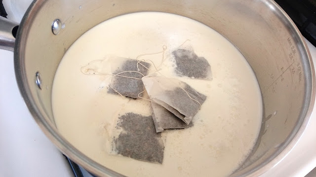 a small sauce pan filled with the ice cream mixture and chai tea bags