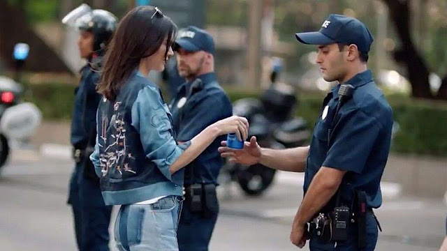 Protesters give Pepsi to police to troll Kendall Jenner’s commercial