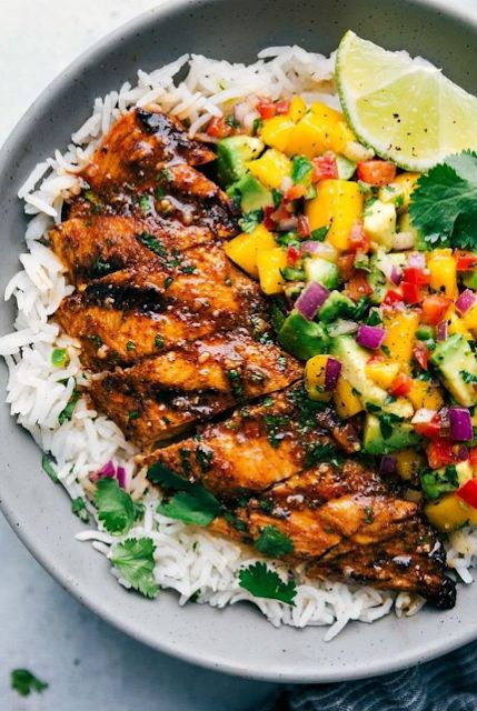 Cilantro-Lime Chicken with a Mango Avocado Salsa - This cilantro lime chicken is easy to make and packed with flavor! While the cilantro lime chicken can stand on its own, I've included accompanying recipes for a cilantro lime rice base and a delicious mango avocado salsa. This transforms this cilantro lime chicken into a tasty and healthy meal that is sure to be a hit. #avocado #healthyrecipe #recipe