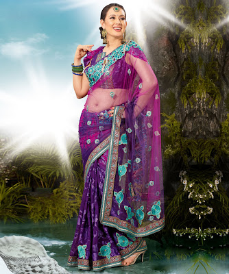 Preeti Jhangiani- Net pallu body Brasso - Heavy multi and ribbon work    BRAND: Ambica Fashion CATEGORY: Saree with Unstitched Blouse COLOUR: Purple and Pink MATERIAL: Net and Brasso SIZE: Saree- 5.5 meters Blouse- 0.80 meters