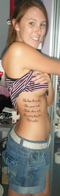 writing tattoo on side body picture