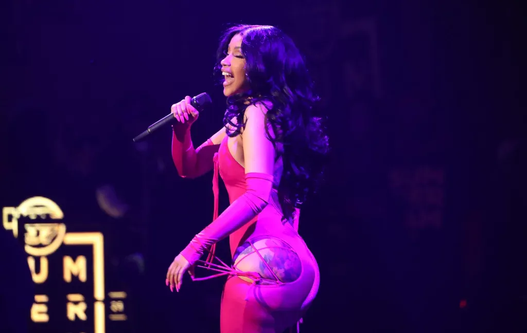 Cardi B Shows Off Her Bum Tattoos in a Plunging Lace-Up Catsuit