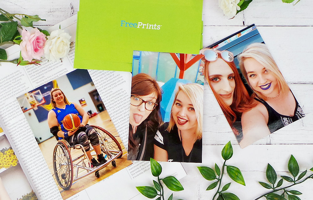 3 photos are laid out with a green free prints envelope. L-R the first photo is me in my basketball chair holding a ball. The middle is a selfie of Sarah and I, The last photo is a selfie of me and Charley