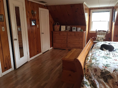 wood furniture and knotty pine walls