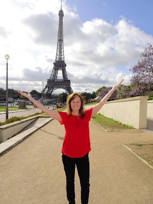 Woman standing in front of Eiffel Tower