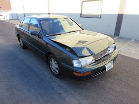 Toyota Avalon with collision damage before repair at Almost Everything Auto Body